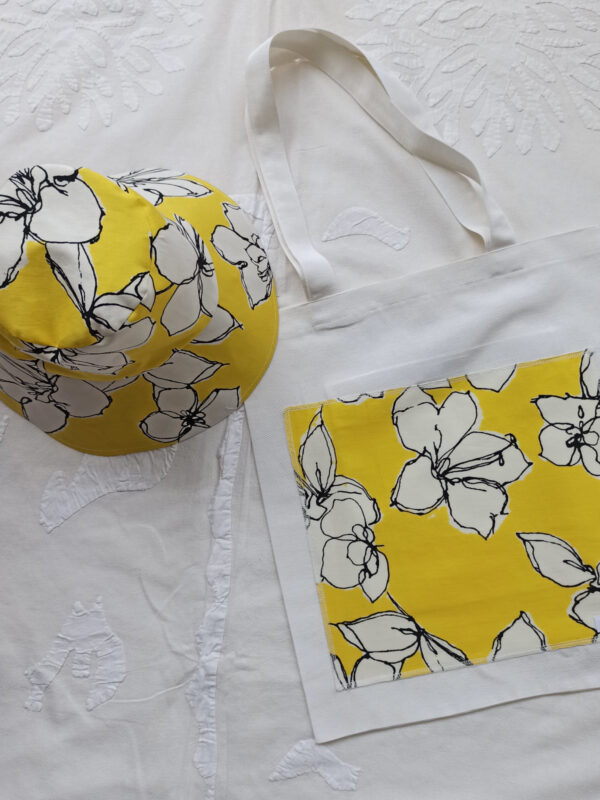 Yellow bucket hat in cotton with bag by pepperose n with floewrs in